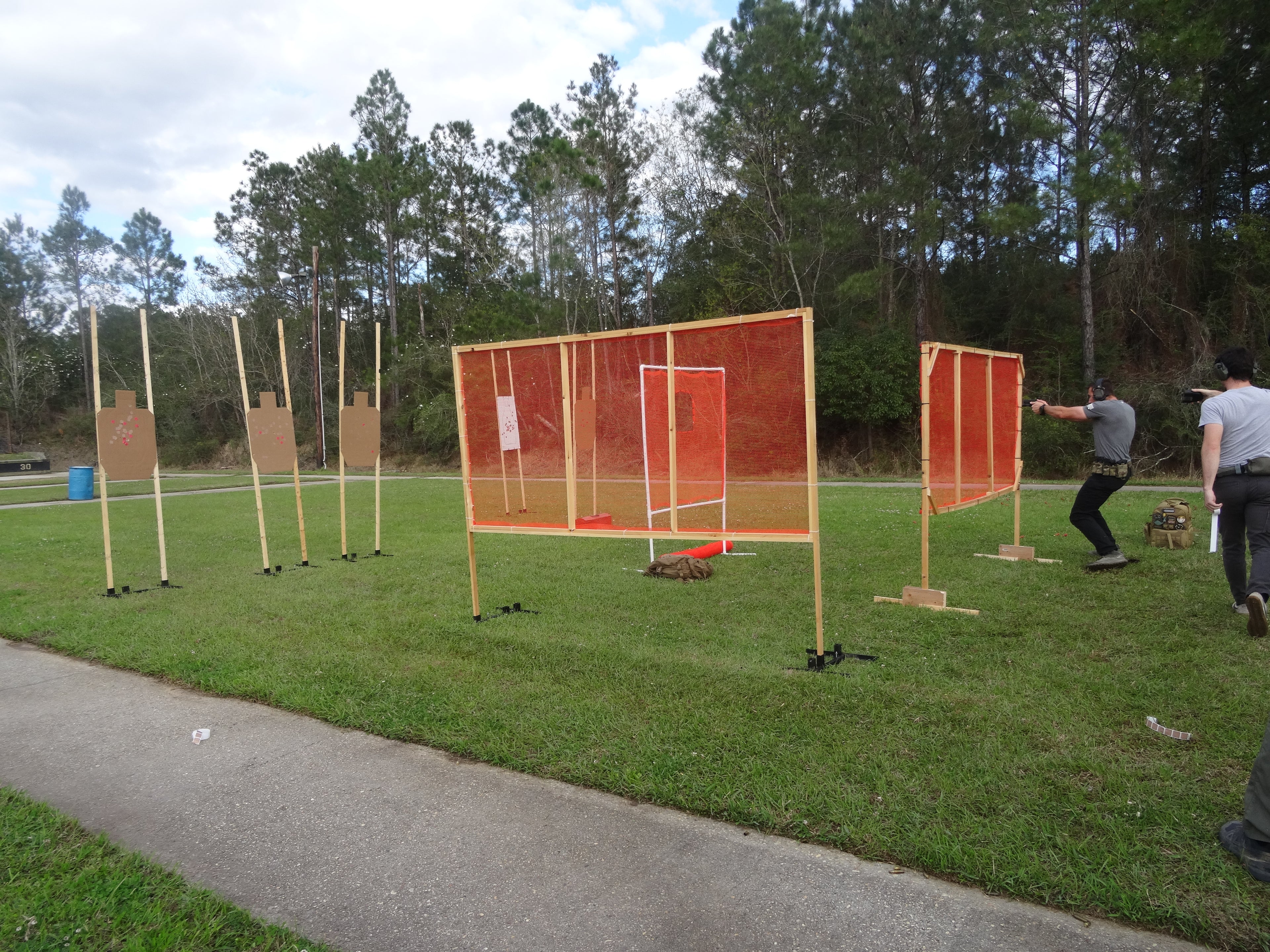 Wind-resistant shooting range netting barrier outdoors